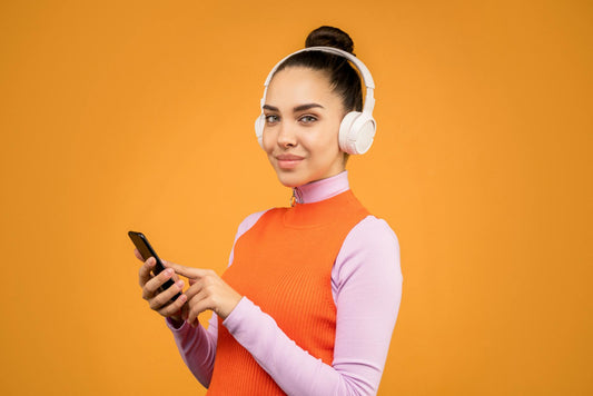 female with smartphones and headphones