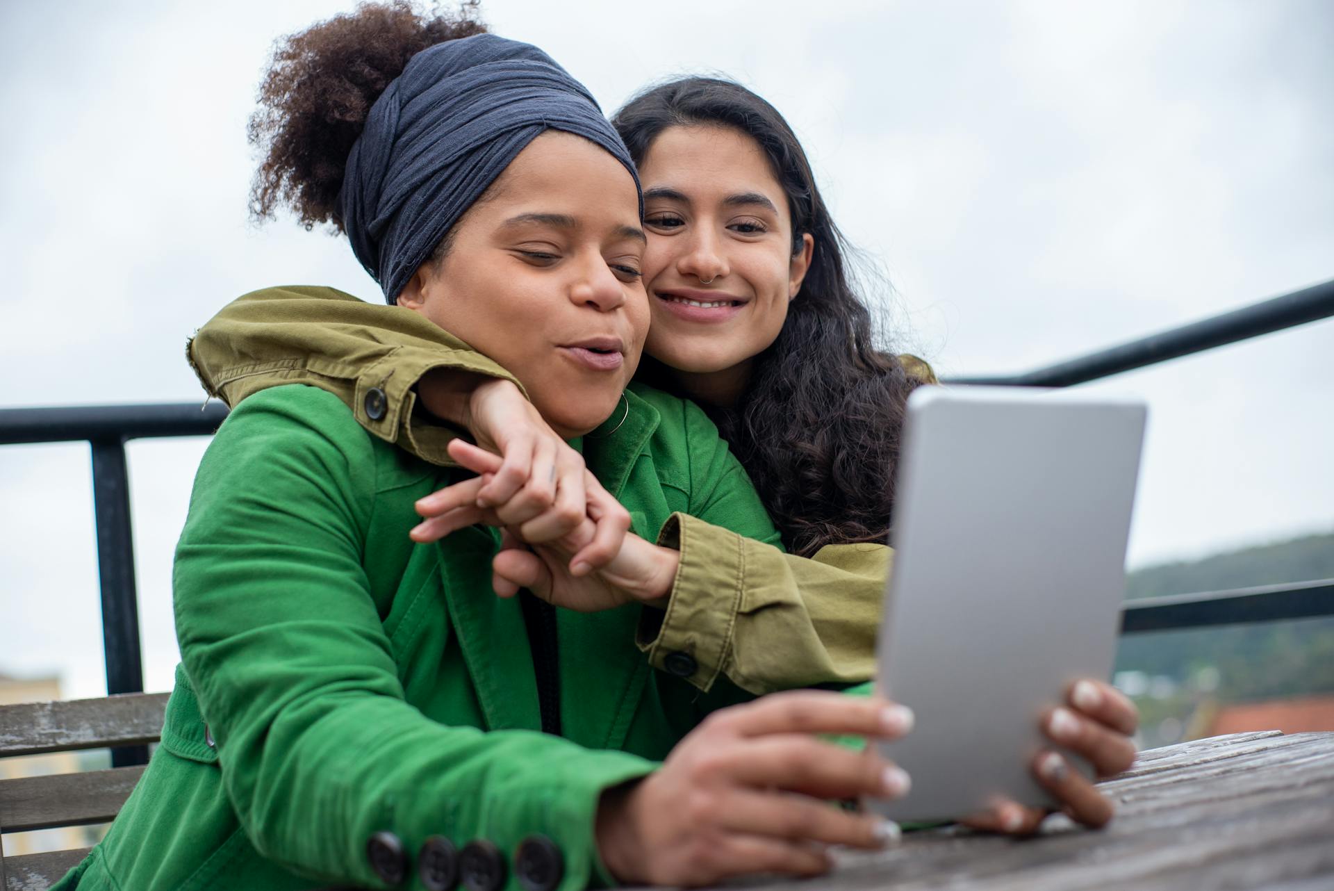 Two women looking at a tablet together outdoors. Browse all ZapTroni products – from wireless headphones and smartwatches to laptops, RC toys, and home gadgets. Shop premium tech, lifestyle accessories, and innovation at unbeatable prices.
