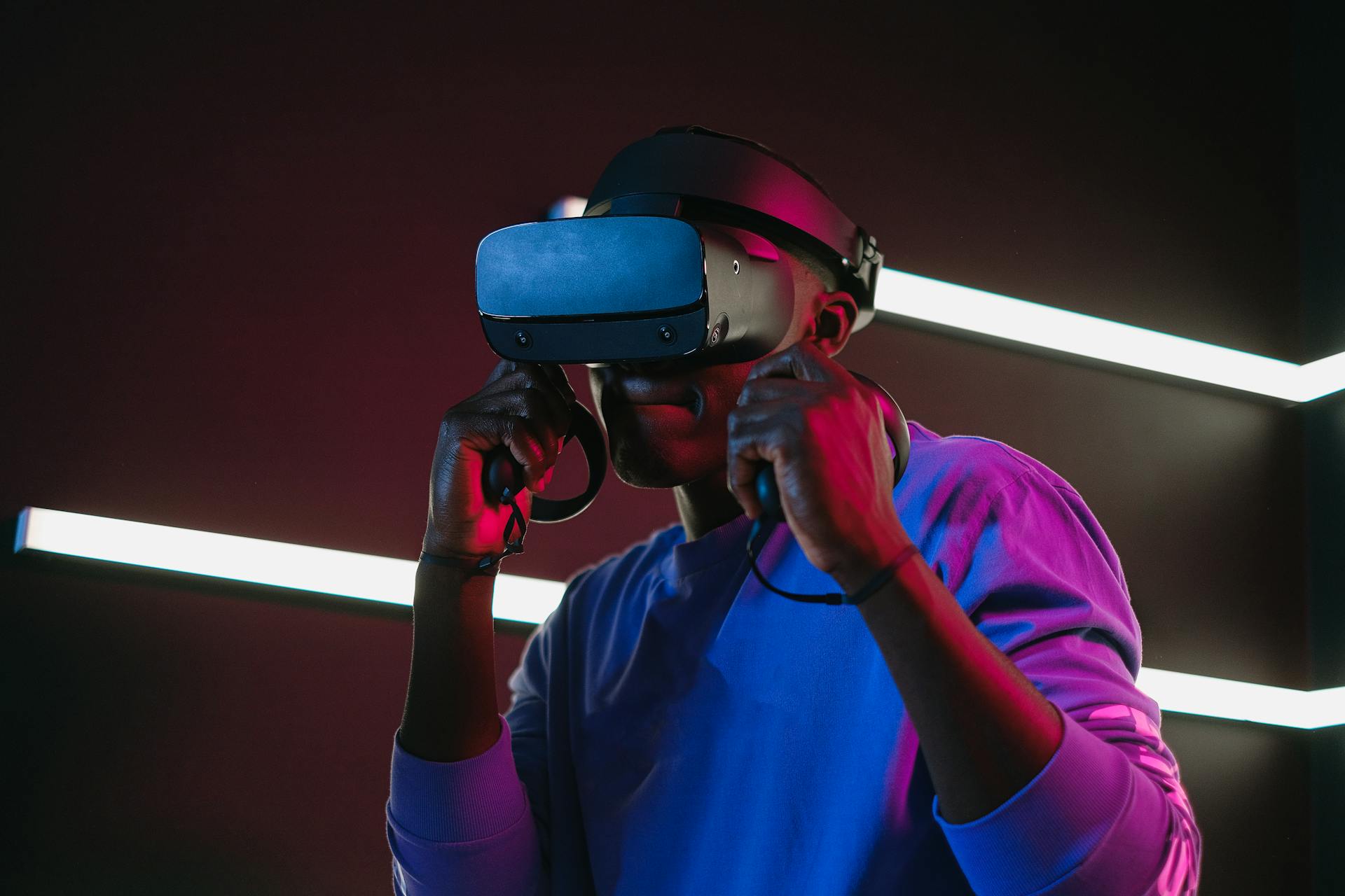 Browse all ZapTroni products – from wireless headphones and smartwatches to laptops, RC toys, and home gadgets. Shop premium tech, lifestyle accessories, and innovation at unbeatable prices. Person wearing a VR headset with neon lights in the background